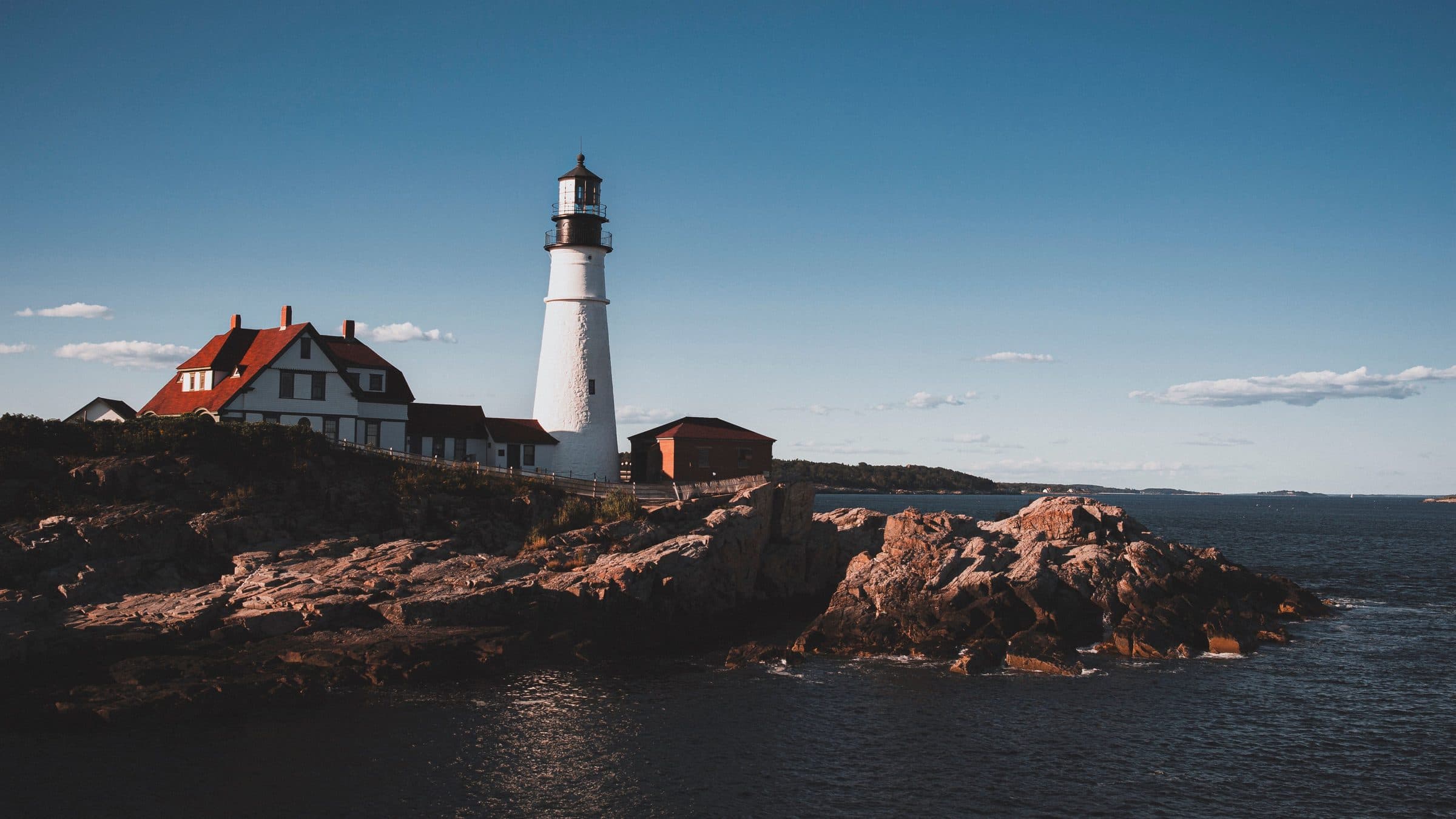 Portland Head Light on the rocky Maine coast at sunset