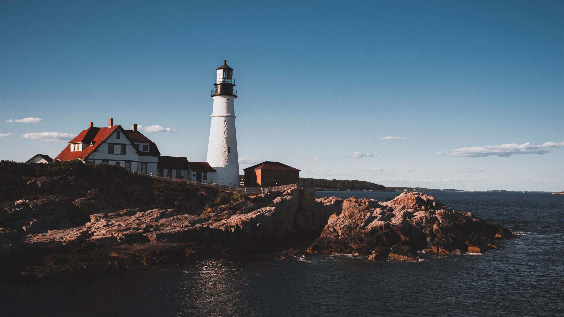 Portland Head Light on the rocky Maine coast at sunset